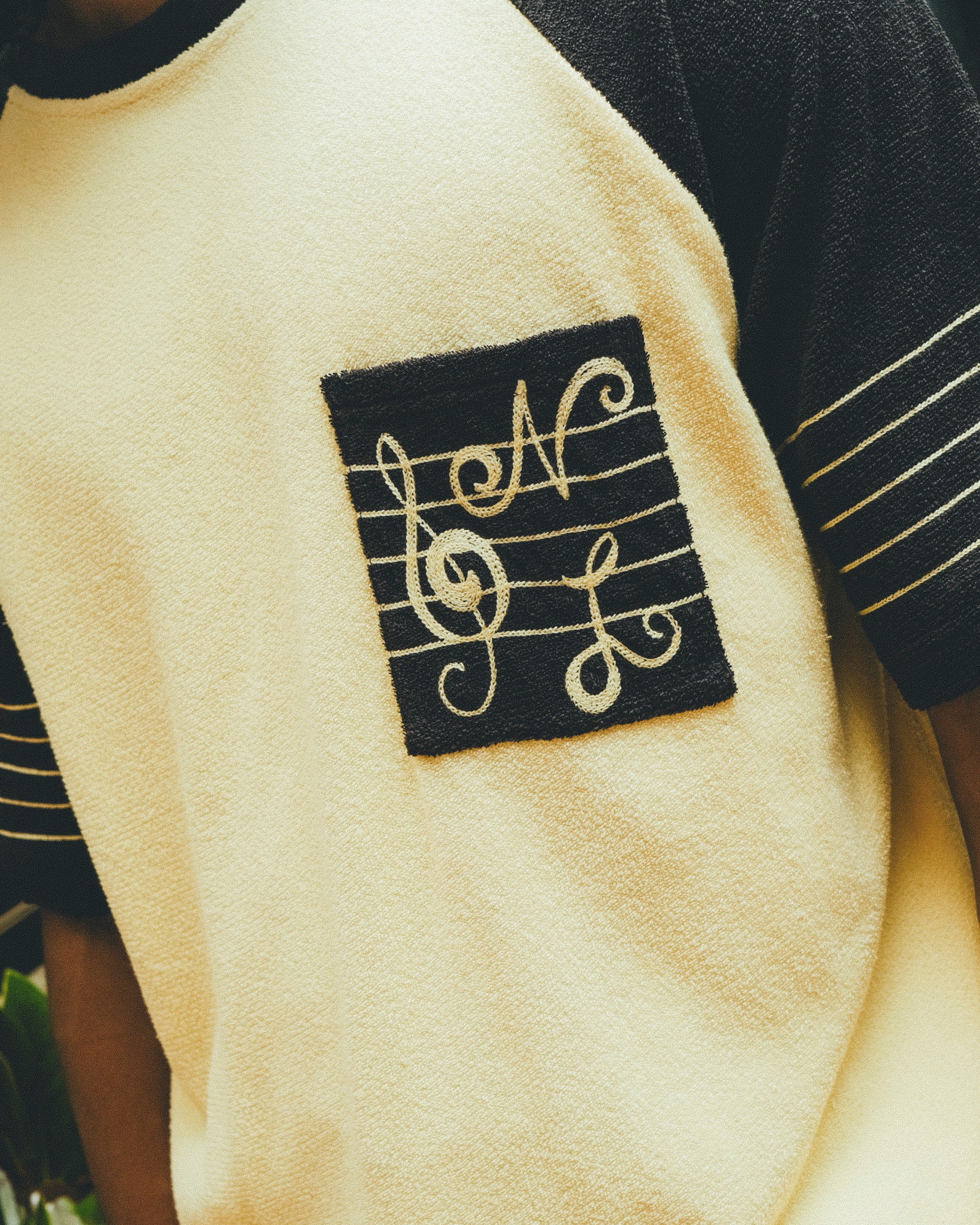 Close-up of SNL embroidery on chest pocket. 