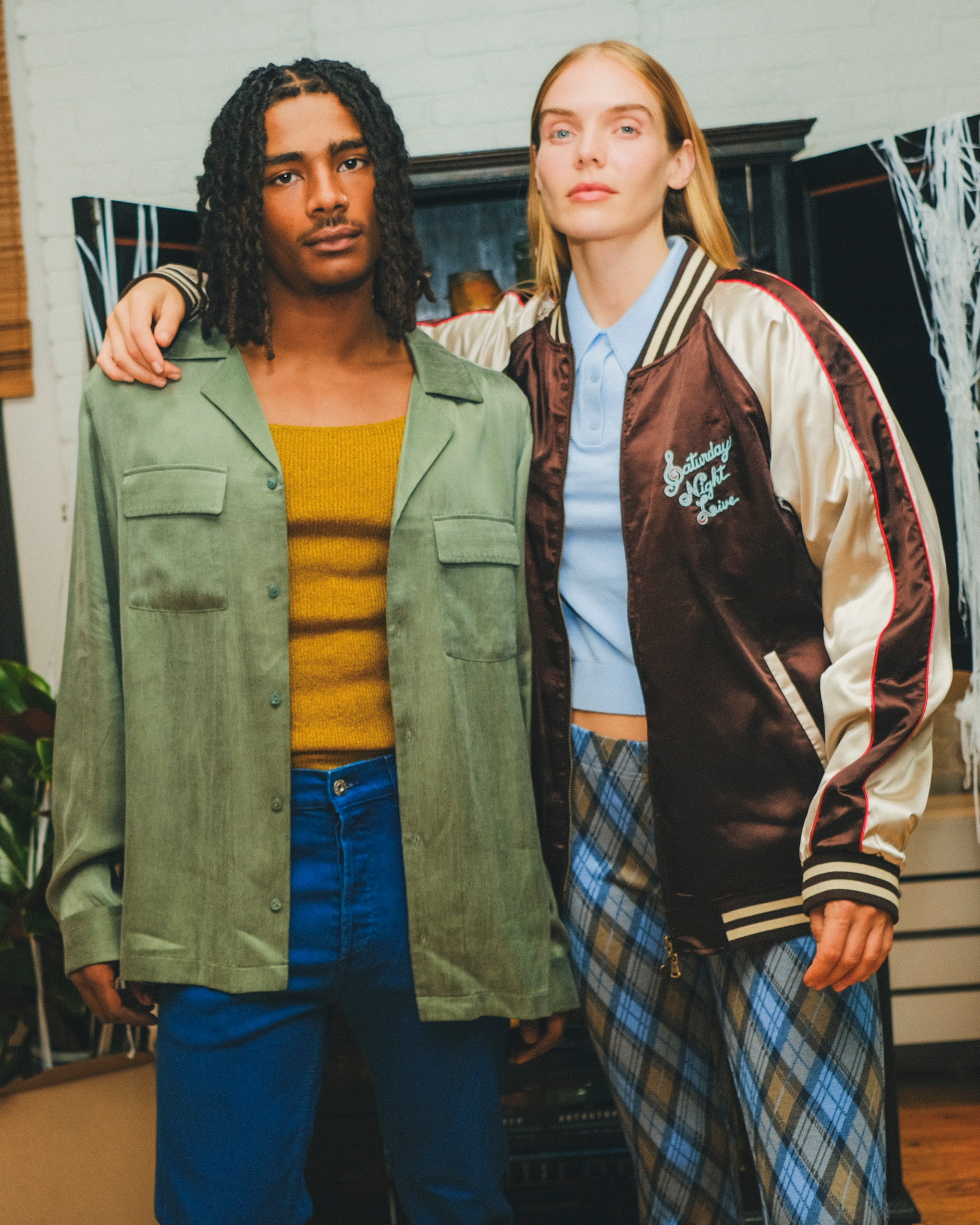 Two models wearing different SNL products. 