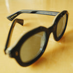 close up of black framed sunglasses with 'LARGO LIMITED EDITION 113/210' in interior