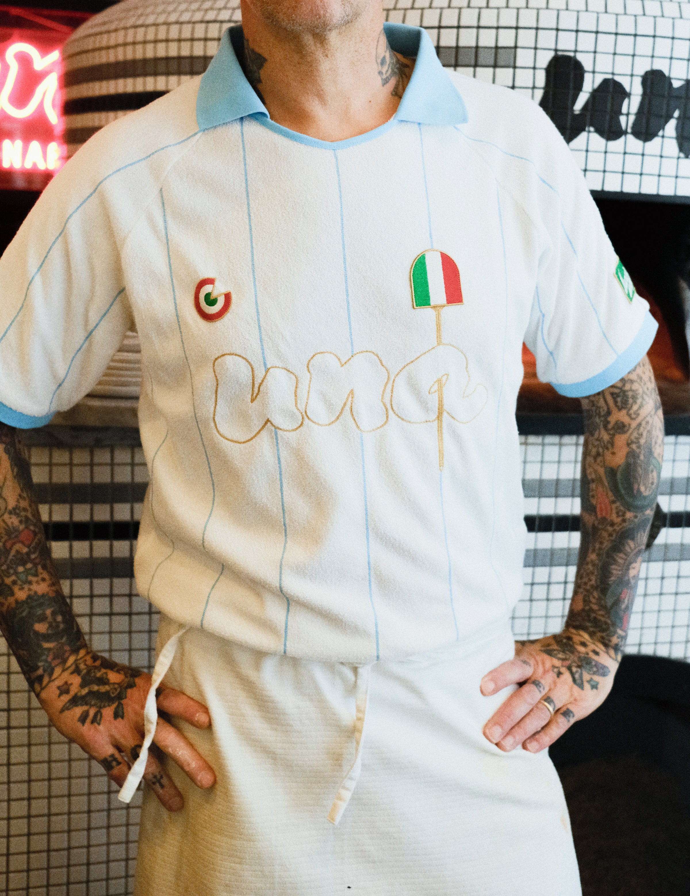 Close-up of Una Pizza owner wearing the Una Pizza Jersey. 