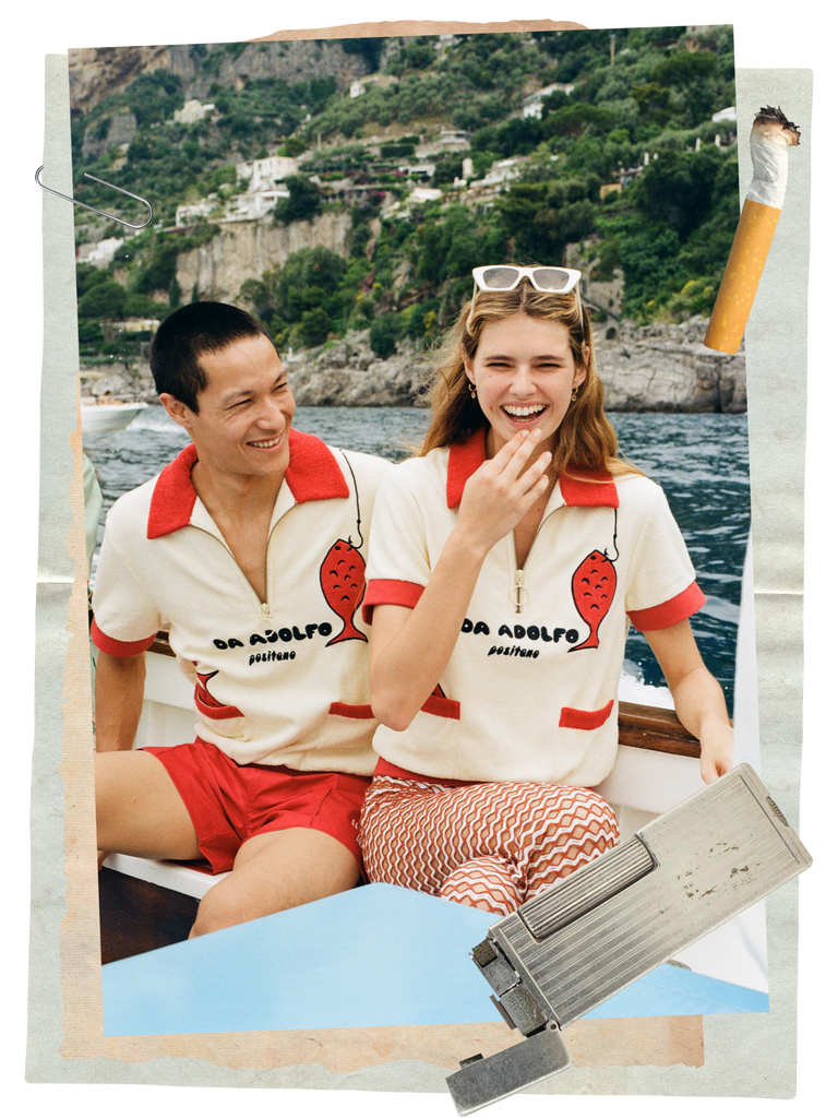 Man and woman laugh together while sitting on a speedboat wearing the Da Adolfo cabana shirts
