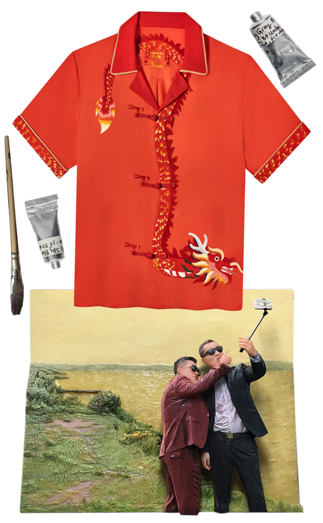 A Tombolo shirt depicts a dragon. Below it is a relief sculpture of two men taking a selfie in front of a yellow river.