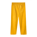 Back view of yellow corduroy pants with an elastic waistband and a single back patch pocket on the right side.