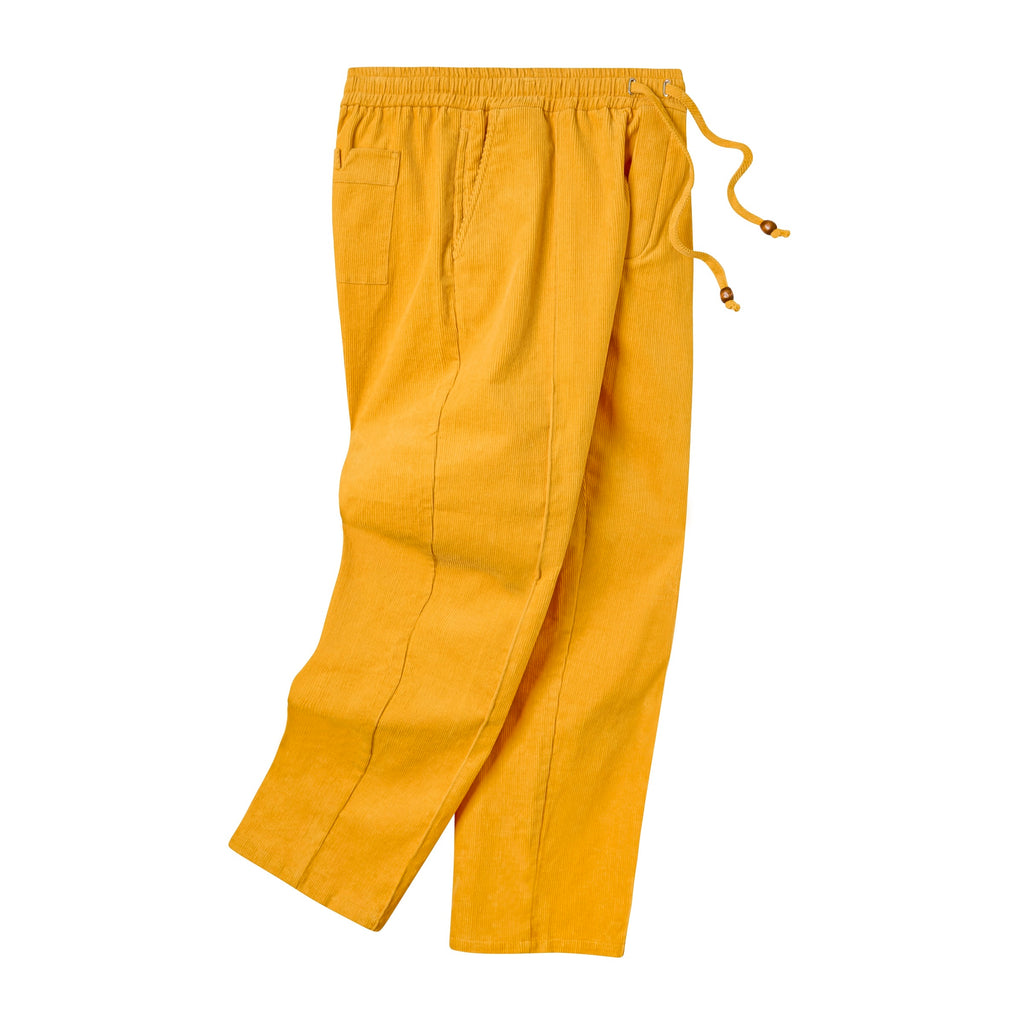 Flat lay of bright yellow corduroy pants featuring an elastic waistband with drawstring ties, side pockets, and a back patch pocket.