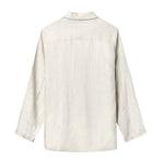 Beige linen suit laid flat showing the back