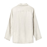 Beige linen suit laid flat showing the back