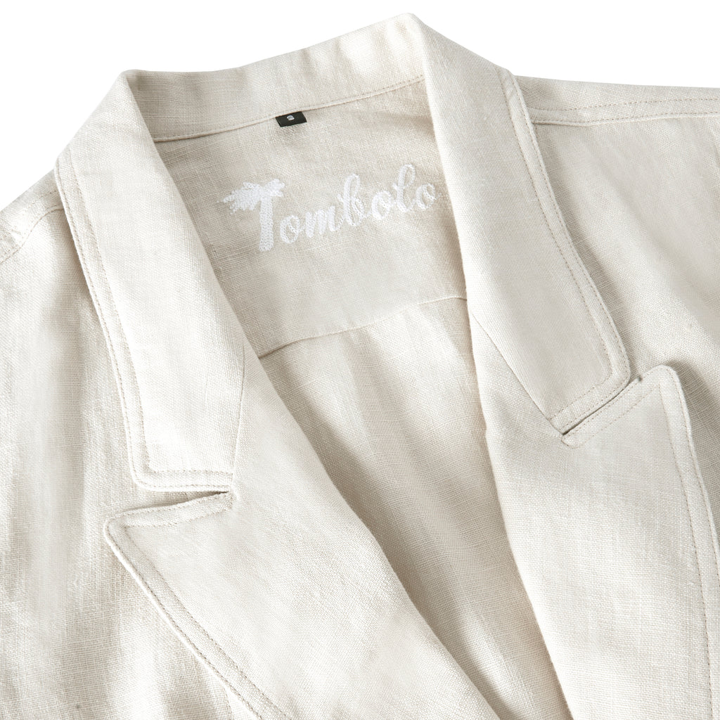 Lapels of beige linen suit showing Tombolo embroidery