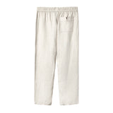 Beige linen pants laid flat from the back