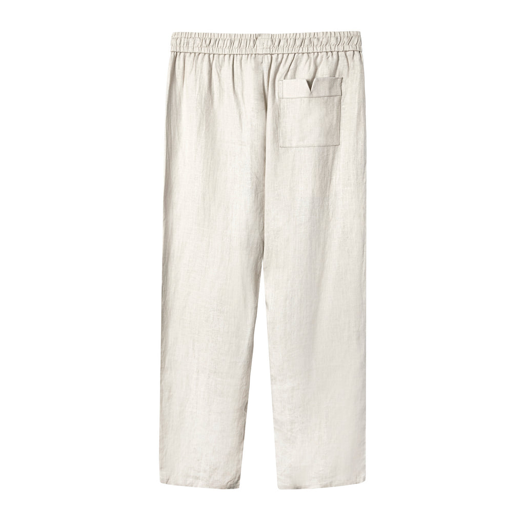 Beige linen pants laid flat from the back
