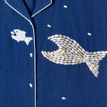 Close-up image of the 'Teamwork' Cabana ~ Crop Cut's left panel which features fish-shaped buttons that have been carefully assembled into the shape of a larger fish.