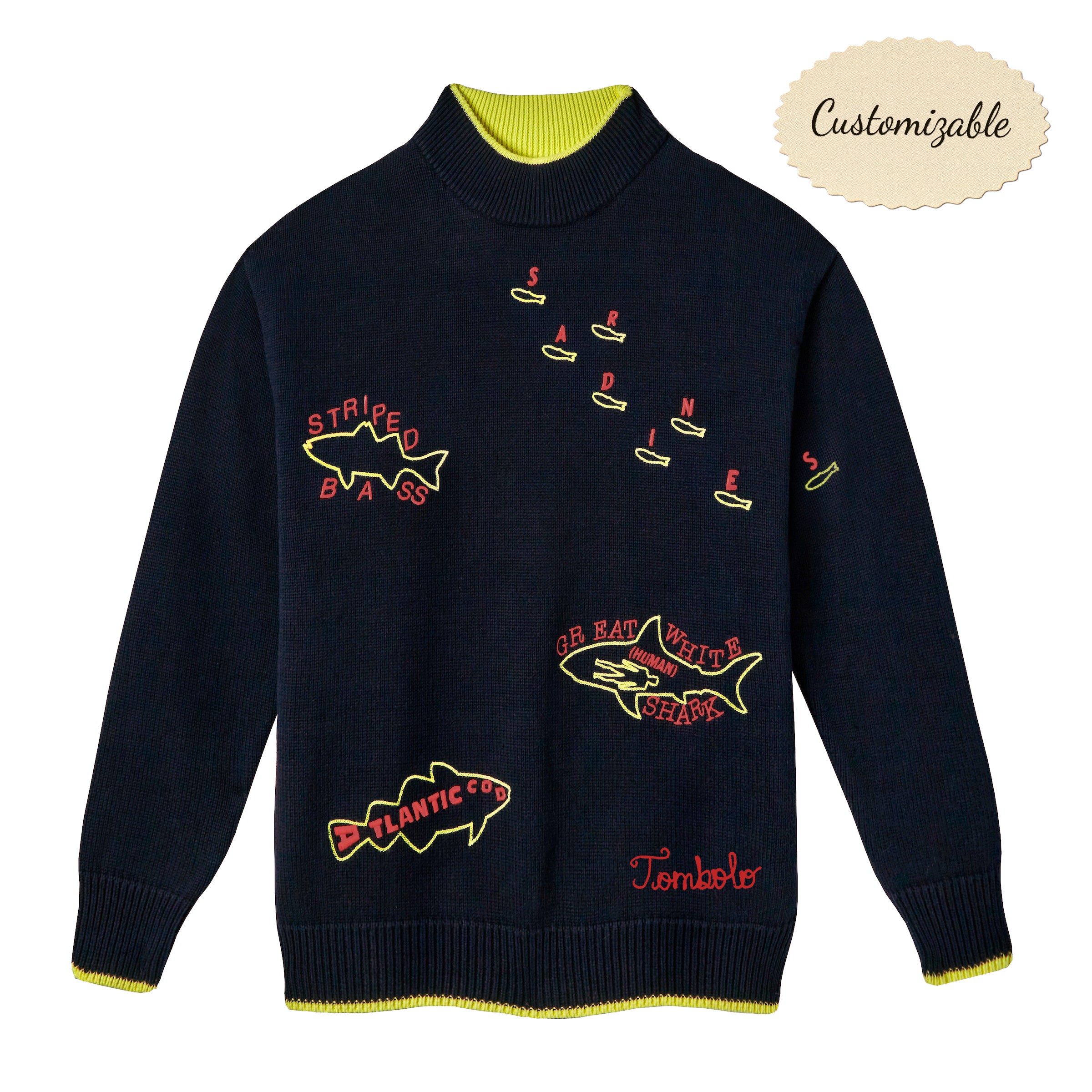Navy knit sweater with neon yellow and red embroidered fish names, including 'Striped Bass', 'Atlantic Cod', 'Sardines', and 'Great White Shark (Human)'. Features ribbed cuffs and hem with yellow contrast detail, and red embroidered 'Tombolo' text at the waist.