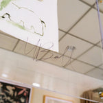 Zoomed-in image of the artist, Mary Ball's signature on the glass case.