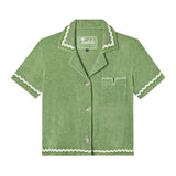 Front-facing product image of the 'Rick Rack' Cabana ~ Crop Cut (green) made of 100% Organic Cotton Terry Cloth that features oversized agoya shell buttons, signature Tombolo v-slit pocket on chest, overlapping rick rack embroidery on collar, cuffs, and bottom sweep, and a custom woven Tombolo label.