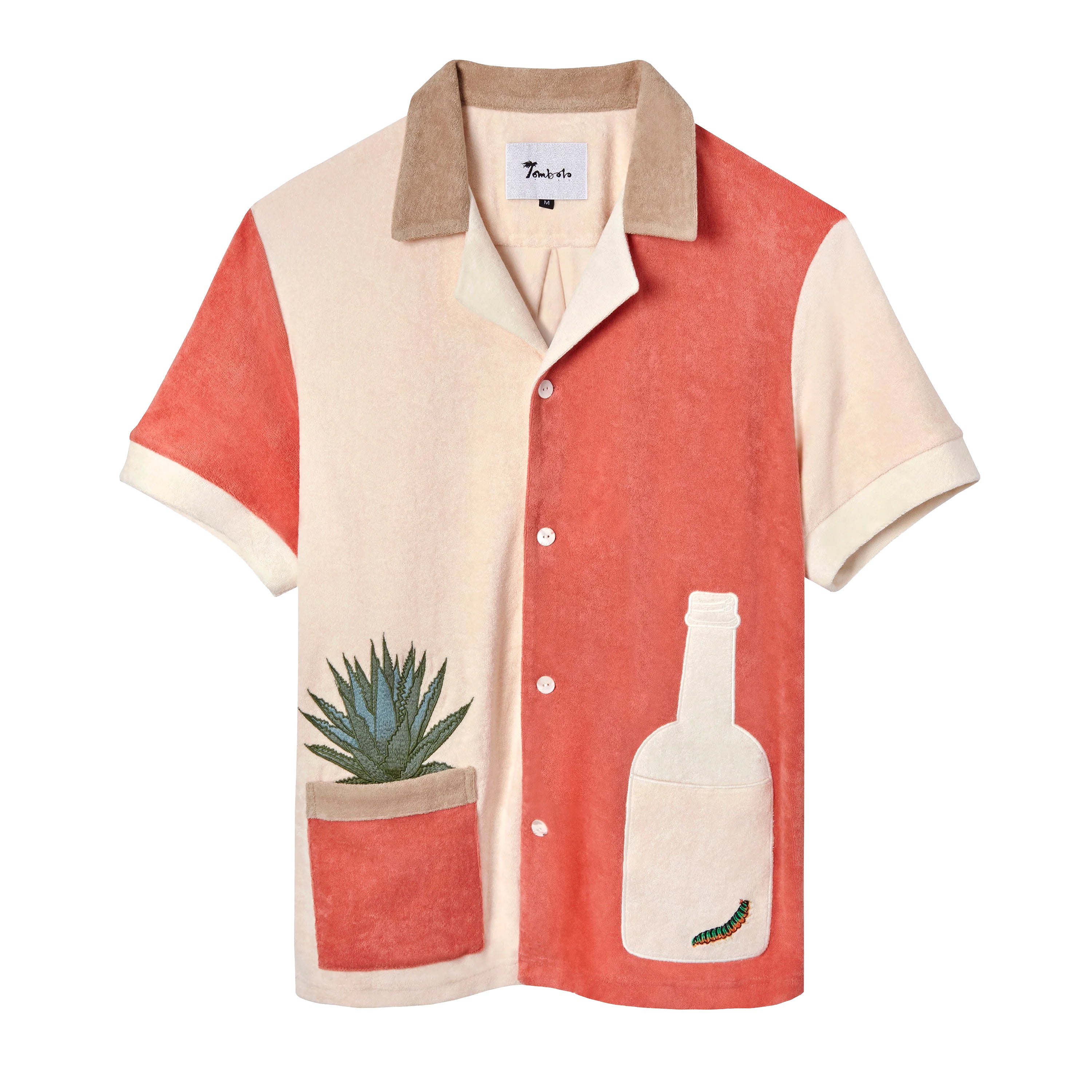 Tombolo salmon and light pink cotton terry cloth shirt with a light pink tequila bottle with a green worm inside on the right and an agave plant in a salmon colored pot on the left side, has a beige collar and four white buttons
