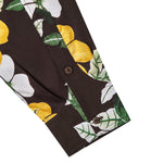 Close up angle of the sleeve on the "Night Bloom" longsleeve that showcases the Hibiscus pattern in addition to the two coconut shell buttons on placket and cuffs.