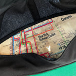 Inside panel of cap showing New York subway guide