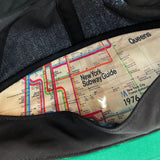 Inside panel of cap showing New York subway guide