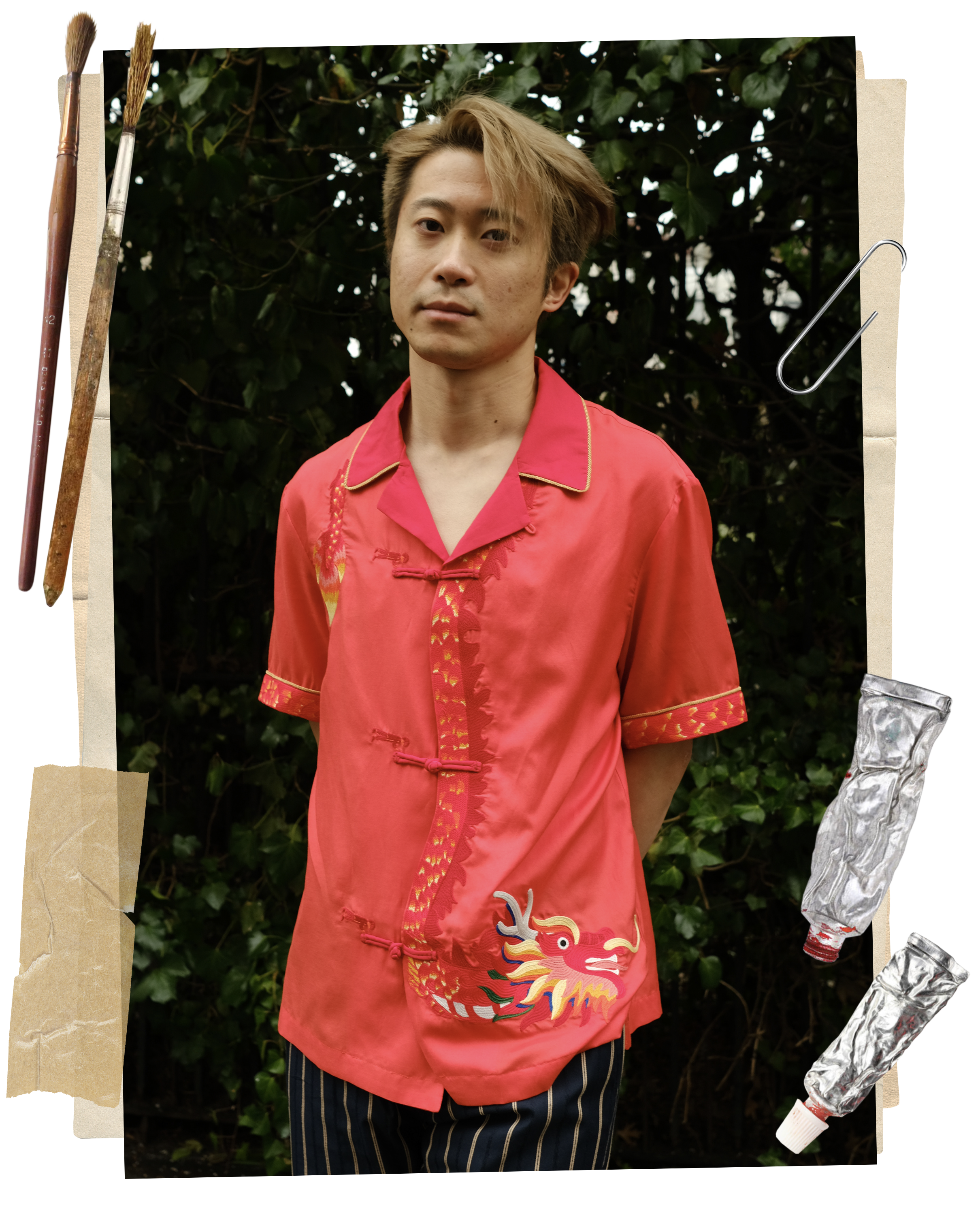 Artist Jiannan Wu wearing a Tombolo x Jiannan Wu red button down shirt with a dragon on it in front of a green background