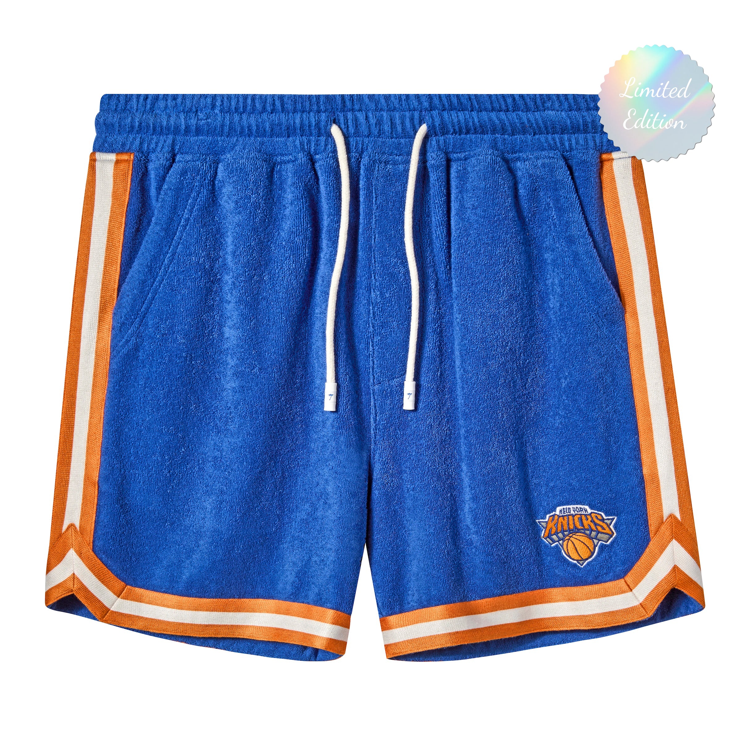 Bright blue terry cloth shorts with white drawstrings and orange-and-white stripes down the sides and hem, featuring the New York Knicks logo embroidered on one leg.