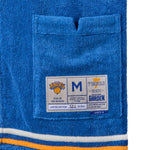 Close-up image of the Tombolo interior label, featuring the New York Knicks logo and their homebase of Madison Square Garden.