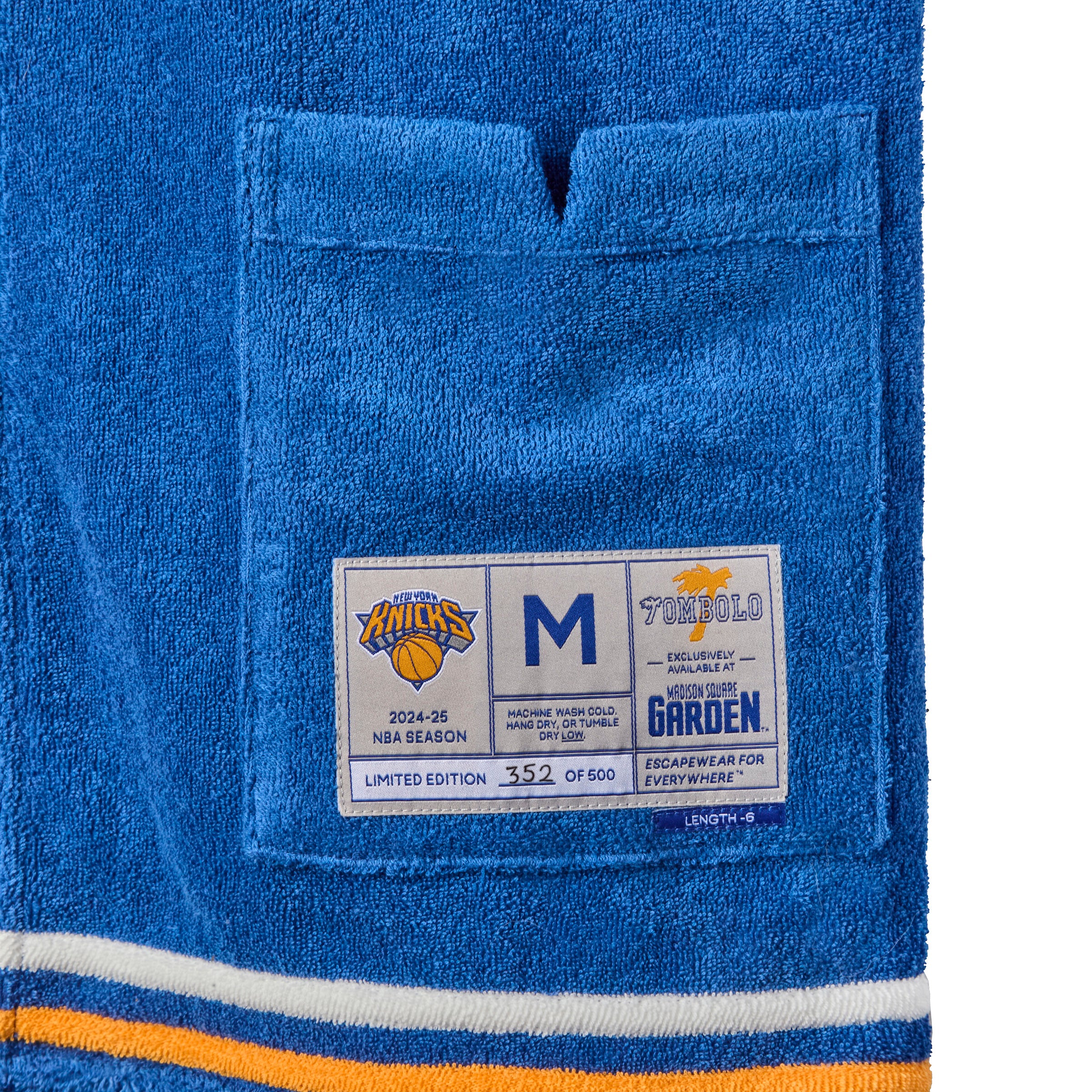 Close-up image of the Tombolo interior label, featuring the New York Knicks logo and their homebase of Madison Square Garden.