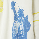 Blue silhouette of the Statue of Liberty.