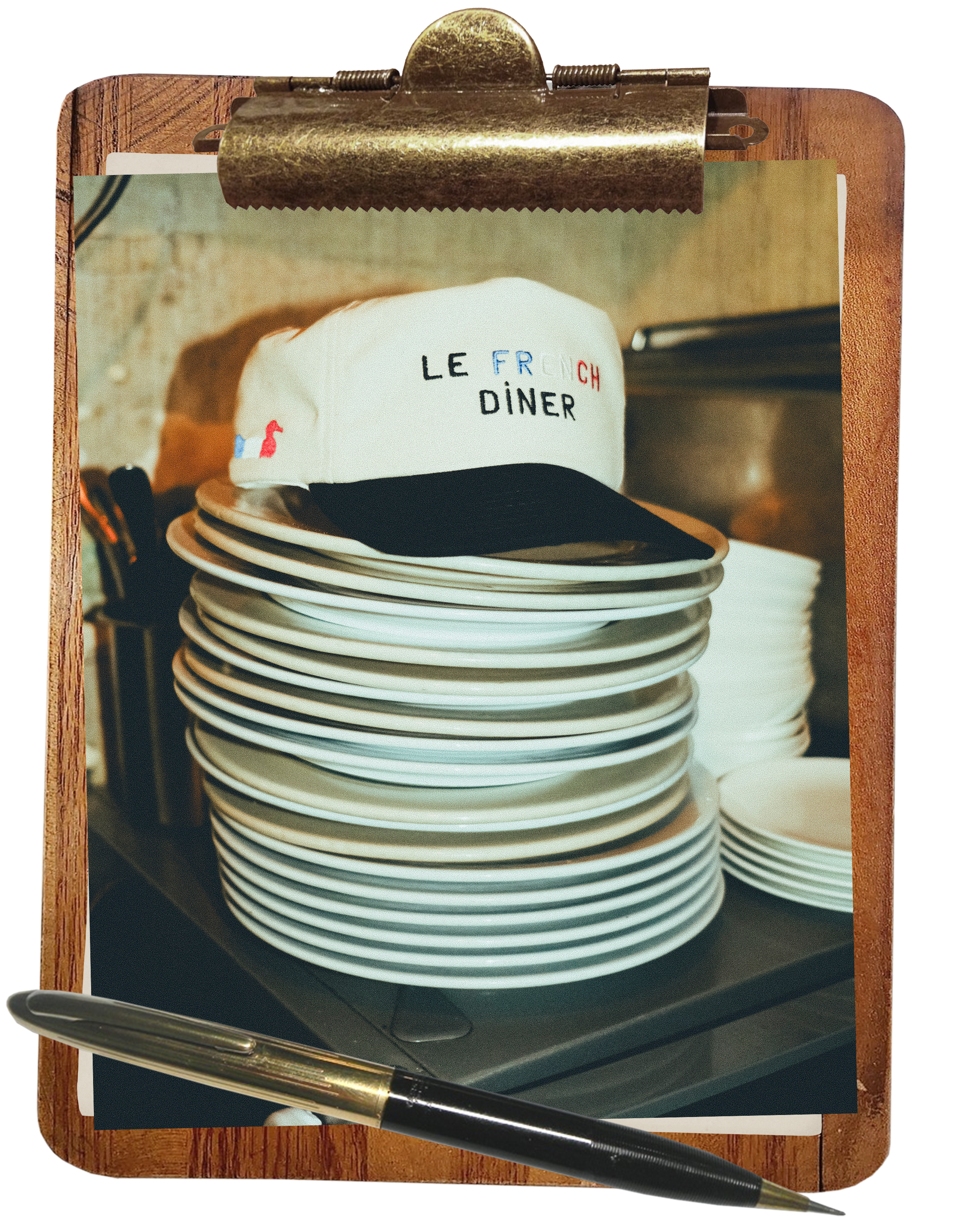 Stack of white plates with a 'Le French Diner' cap on top, displayed on a clipboard.