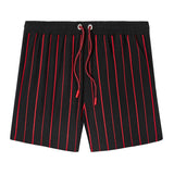 Front-facing product image of 'The Sopranos' Lineup Swim Trunks that features zippered side pocket – perfect for a phone or keys, chain-stitched, alternating thickness stripes, custom 'The Sopranos' x Tombolo interior label, metal stoppers on red and black twist drawstrings, and a custom woven label. 