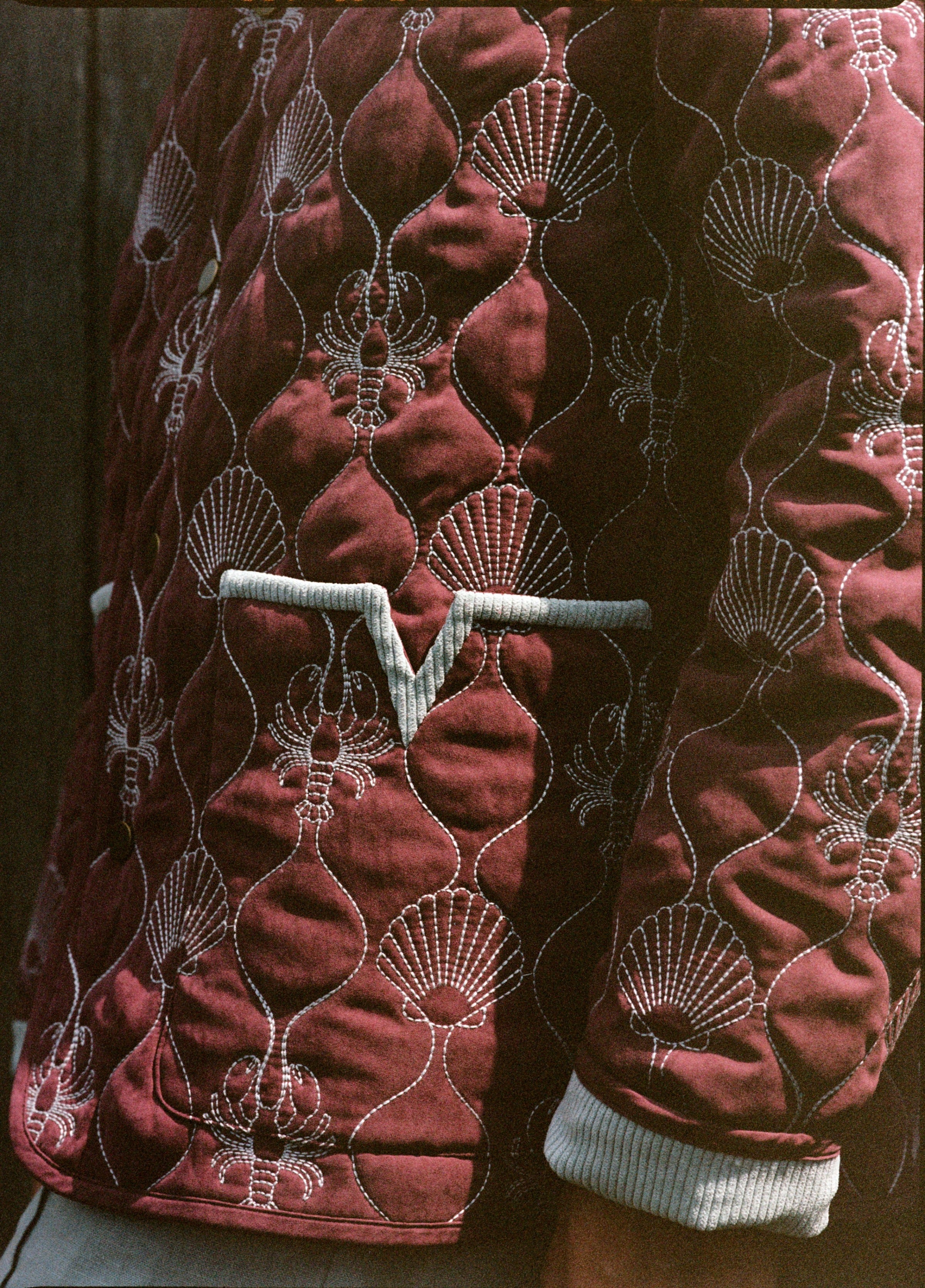 close up of v pocket on jacket