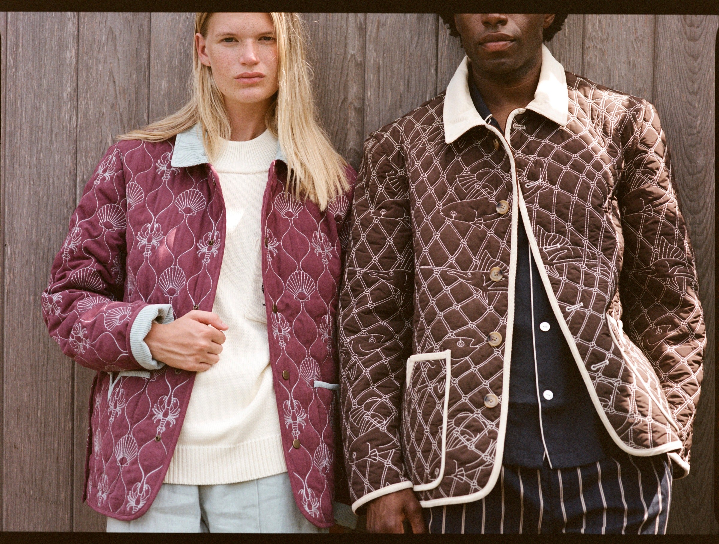 Man and woman stare at camera in quilted jackets