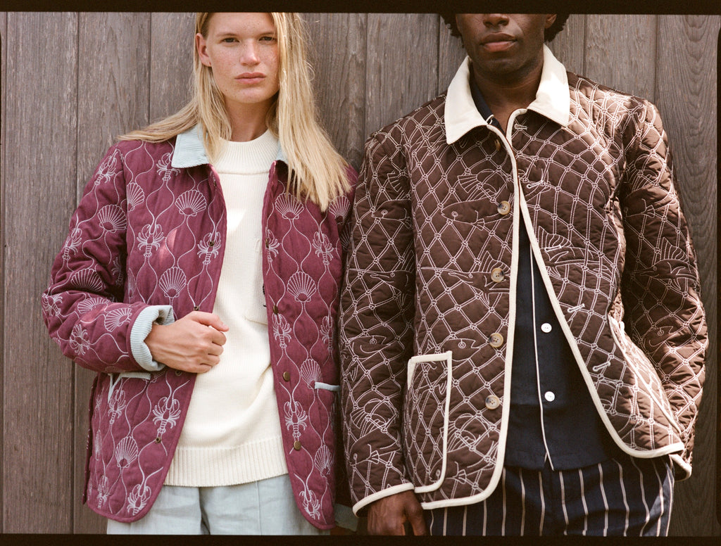 Man and woman stare at camera in quilted jackets