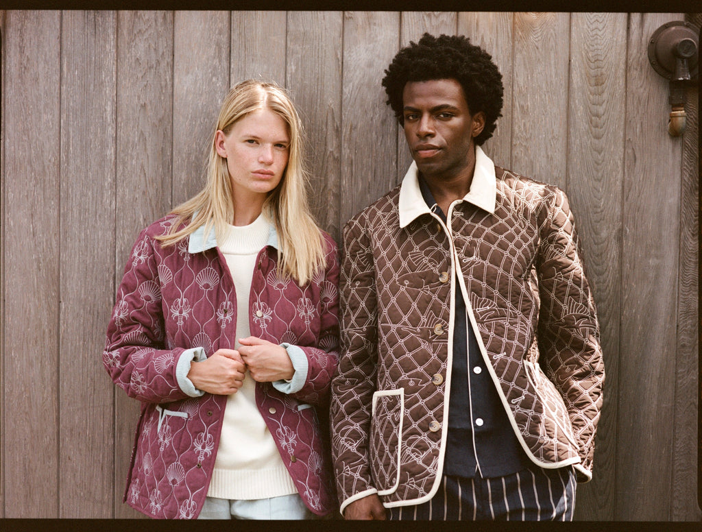 upper body shot of man and woman wearing quilted jackets