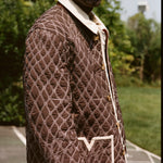 Man wears jacket with picture cropped below his eyes