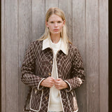 Woman wears unbuttoned jacket