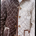 Man showing both sides of reversible jacket 