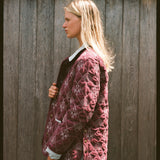 Woman shows side of jacket 