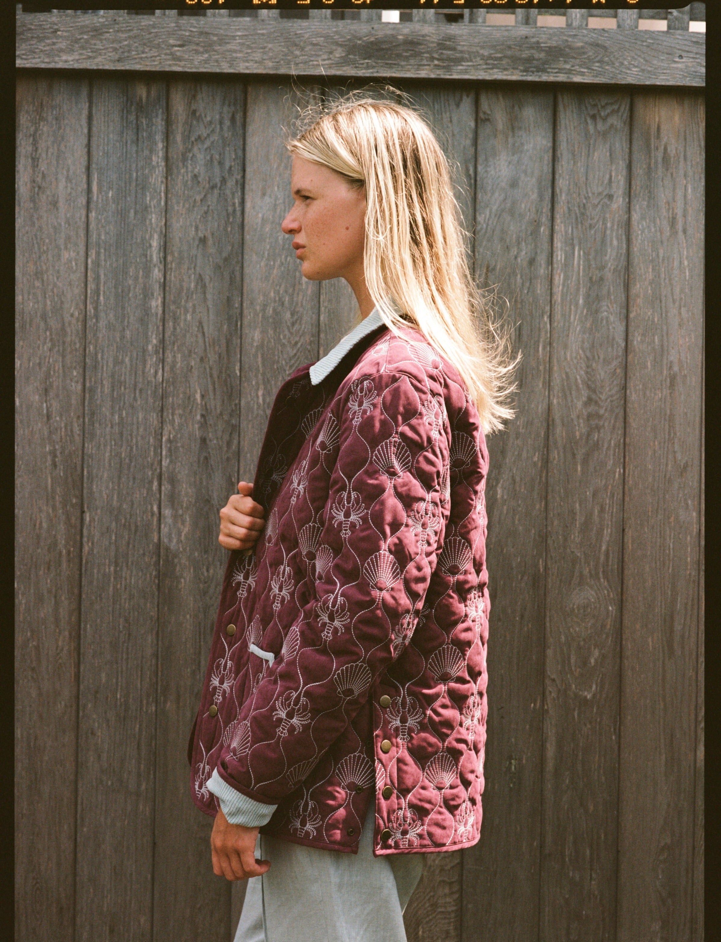 Woman shows side of jacket 