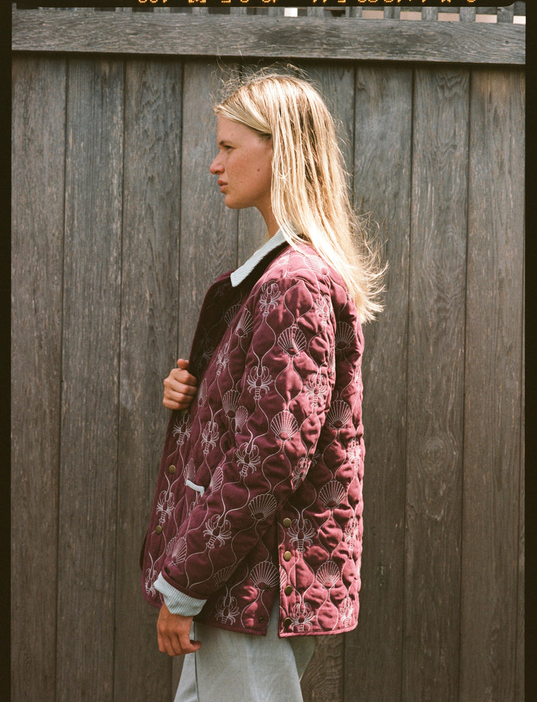 Woman shows side of jacket 
