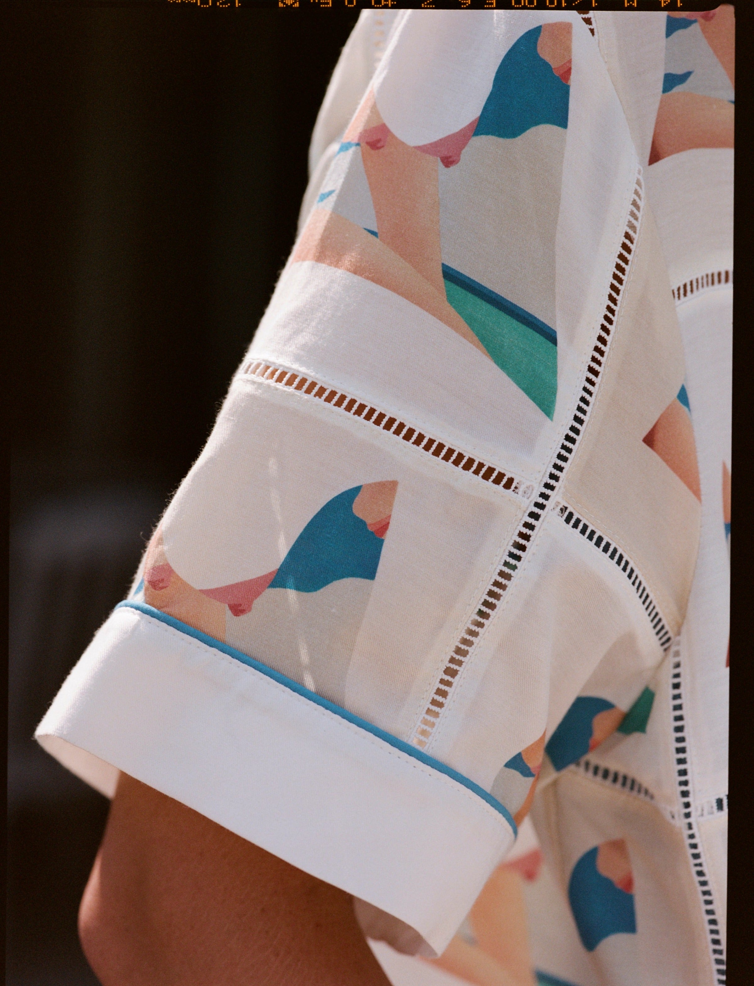 Close up of wesselman motif on stitched shirt