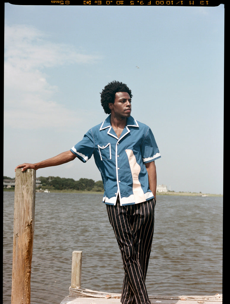 Man wearing wesselman shirt on pier