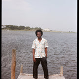 Man stands at end of dock
