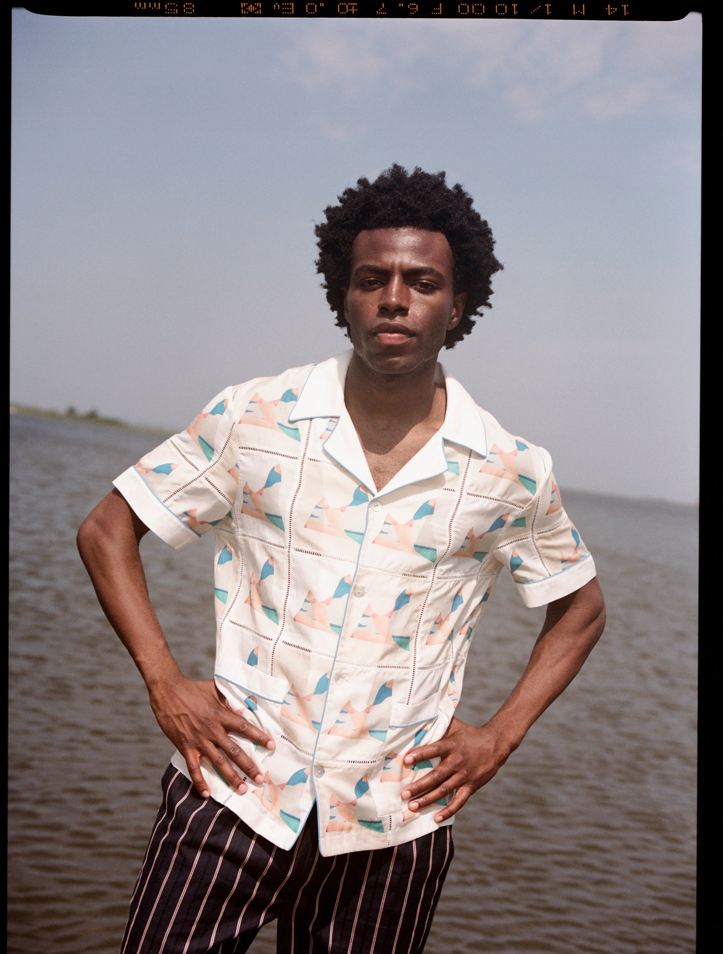 Man puts hands on hips 