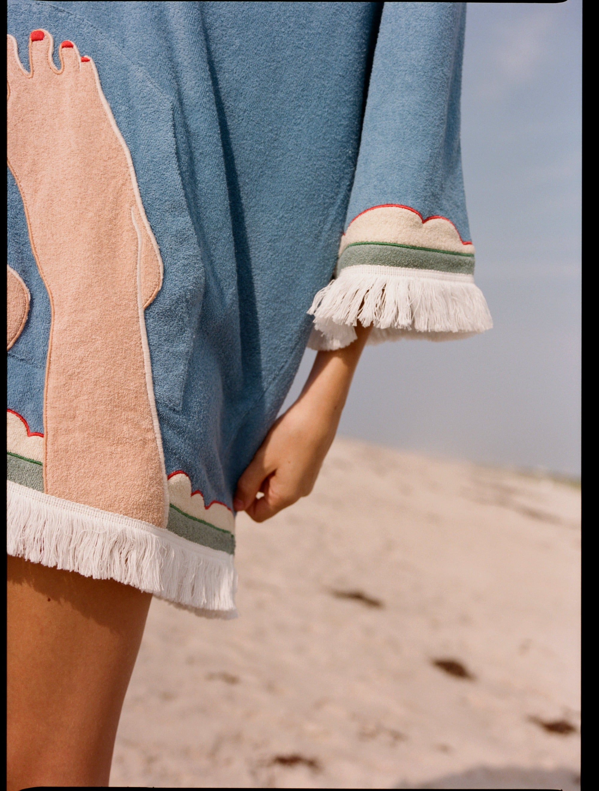 close up of foot motif on poncho