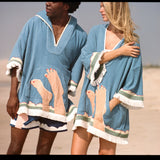 Mid body shot of man and woman wearing matching ponchos