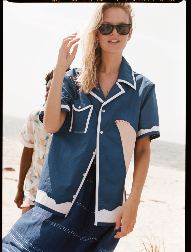 Woman wearing wesselman shirt on beach 