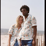 Man and woman pose together looking at the camera