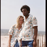 Man and woman pose together looking at the camera