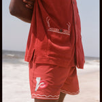 Man wearing matching set with smoking lips