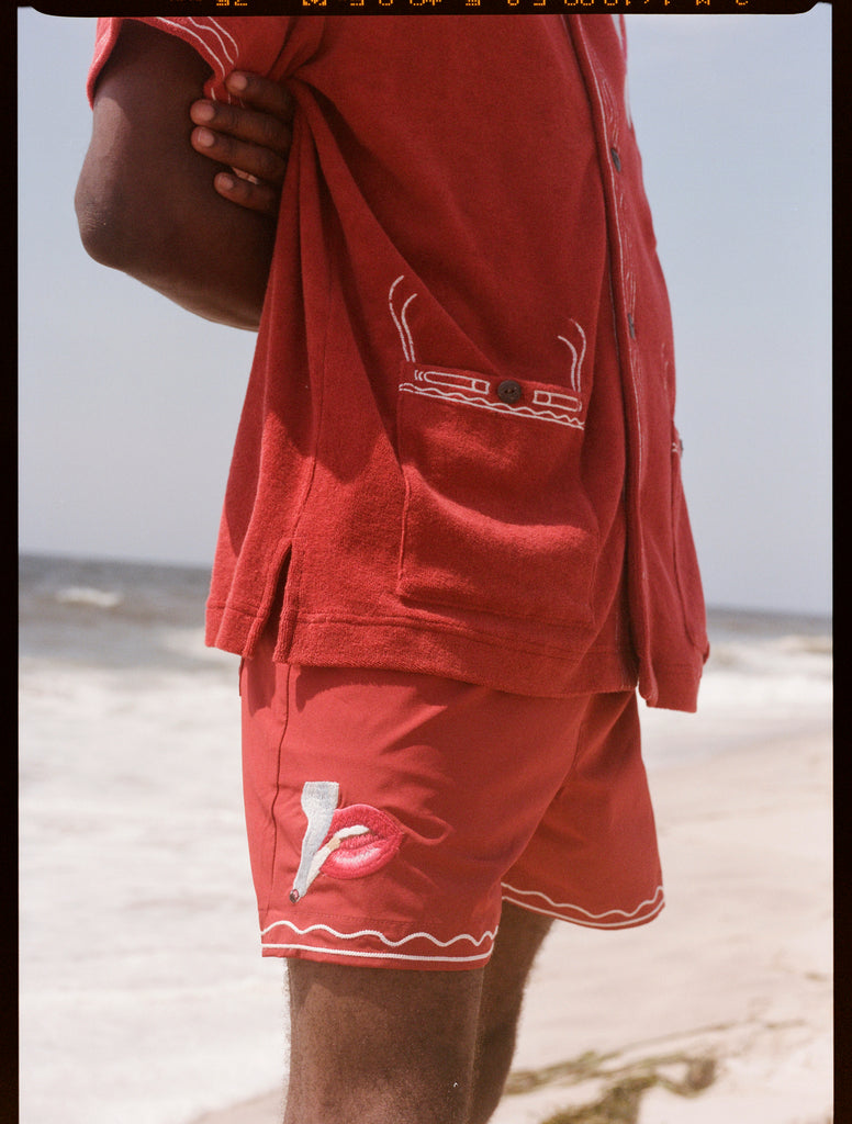 Man wearing matching set with smoking lips