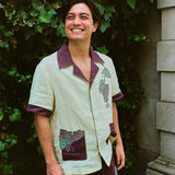 Lukas wearing the full tombarolo set smiling and looking up